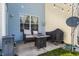 Cozy patio with an outdoor seating area, grill, and stone fire pit perfect for relaxing or entertaining at 9575 Thradd St, Fishers, IN 46038