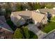 Aerial view of a home with well-maintained landscaping, a two-car garage, and a porch at 9626 Oakhaven Ct, Indianapolis, IN 46256