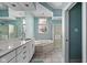 Well-lit bathroom with a soaking tub, shower, and white vanity at 9626 Oakhaven Ct, Indianapolis, IN 46256