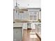 Bright kitchen with stainless steel appliances, granite countertops, a large island, and hardwood floors, perfect for cooking at 9626 Oakhaven Ct, Indianapolis, IN 46256