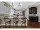 Gourmet kitchen featuring a large island with bar seating, granite countertops, and stainless steel appliances at 9626 Oakhaven Ct, Indianapolis, IN 46256