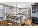 Spacious kitchen with white cabinets, granite countertops, stainless steel appliances, and a breakfast bar for casual dining at 9626 Oakhaven Ct, Indianapolis, IN 46256