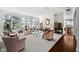 Bright and airy living room with large windows, a fireplace, and plush seating with plenty of room at 9626 Oakhaven Ct, Indianapolis, IN 46256