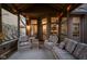 Comfortable porch with warm lighting, wicker furniture and an inviting atmosphere at 9626 Oakhaven Ct, Indianapolis, IN 46256