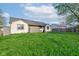 Well-maintained backyard featuring lush green grass and partial fencing for privacy and outdoor enjoyment at 990 Bull Run W Dr, Greenwood, IN 46143