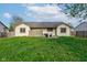 Backyard featuring a lush green lawn and a patio area at 990 Bull Run W Dr, Greenwood, IN 46143