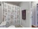 Bathroom featuring a tub with shower and decorative curtain at 990 Bull Run W Dr, Greenwood, IN 46143