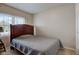 Comfortable bedroom with neutral colors, window, and wood-frame headboard at 990 Bull Run W Dr, Greenwood, IN 46143