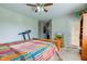 Bedroom featuring a bed, a ceiling fan, and a partially visible treadmill at 990 Bull Run W Dr, Greenwood, IN 46143