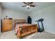 Bedroom showing wood furniture, and a ceiling fan with lighting at 990 Bull Run W Dr, Greenwood, IN 46143