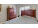 Neutral colored bedroom with solid wood bed frame and side storage at 990 Bull Run W Dr, Greenwood, IN 46143