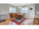 Charming dining room with wood table, chairs, rug, and natural light at 990 Bull Run W Dr, Greenwood, IN 46143