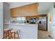 Cozy kitchen featuring a breakfast bar with seating and stainless steel appliances at 990 Bull Run W Dr, Greenwood, IN 46143