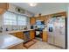 Functional kitchen with stainless steel appliances, ample cabinetry, and natural light at 990 Bull Run W Dr, Greenwood, IN 46143