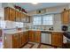 Well-lit kitchen with stainless steel appliances, wood cabinets, and decor at 990 Bull Run W Dr, Greenwood, IN 46143