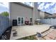 Spacious backyard patio with outdoor seating, a grill, and a well-maintained fence, ideal for outdoor entertaining at 10208 Clear Sky Dr, Avon, IN 46123