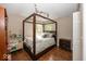 A bedroom with hardwood floors and a four poster bed at 10208 Clear Sky Dr, Avon, IN 46123