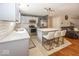 Modern kitchen with white cabinets, stainless steel appliances, and a center island with bar stools at 10208 Clear Sky Dr, Avon, IN 46123