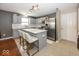 Stylish kitchen featuring white cabinets, stainless steel appliances, and a center island with bar seating at 10208 Clear Sky Dr, Avon, IN 46123