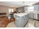 Bright kitchen with white cabinets, a center island, and stainless steel appliances, perfect for cooking and entertaining at 10208 Clear Sky Dr, Avon, IN 46123