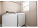 Clean laundry room featuring modern washer and dryer, offering a functional space for laundry tasks at 10208 Clear Sky Dr, Avon, IN 46123