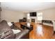 Inviting living room with fireplace, hardwood floors, and plenty of space for relaxation and entertaining at 10208 Clear Sky Dr, Avon, IN 46123
