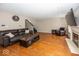 Comfortable living room features a fireplace, hardwood floors, and a staircase to the upper level at 10208 Clear Sky Dr, Avon, IN 46123