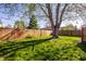 Large backyard featuring a mature tree providing ample shade at 1031 N Lesley Ave, Indianapolis, IN 46219