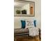 Entryway showing bench with pillows and a decorative mirror at 1031 N Lesley Ave, Indianapolis, IN 46219