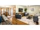 Open-concept living room featuring hardwood floors, modern furnishings, and natural light at 1031 N Lesley Ave, Indianapolis, IN 46219