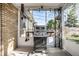 Outdoor patio featuring a built-in grill and views of backyard at 1031 N Lesley Ave, Indianapolis, IN 46219