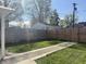 Well-maintained backyard featuring both wooden and chain-link fencing for added privacy at 1041 Hervey St, Indianapolis, IN 46203