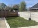 Large grassy backyard with a wooden fence at 1041 Hervey St, Indianapolis, IN 46203