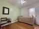 Cozy bedroom featuring hardwood floors, neutral walls, and ample natural light at 1041 Hervey St, Indianapolis, IN 46203