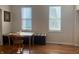 Bright dining area with hardwood floors and a window seat, perfect for casual meals and gatherings at 1041 Hervey St, Indianapolis, IN 46203