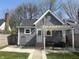Charming home exterior with a pergola-covered patio, perfect for outdoor living at 1041 Hervey St, Indianapolis, IN 46203