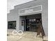 Gray brick building exterior with dark trim and a coffee shop at 1041 Hervey St, Indianapolis, IN 46203