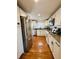 Contemporary kitchen featuring stainless steel appliances, granite countertops, and ample storage space at 1041 Hervey St, Indianapolis, IN 46203