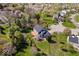 Aerial view of a backyard featuring a deck, gazebo, mature trees, and landscaping at 10417 Mayapple Ct, Noblesville, IN 46060