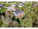 Aerial view of a backyard featuring a deck, gazebo, mature trees, and landscaping at 10417 Mayapple Ct, Noblesville, IN 46060