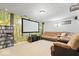 Finished basement with a large screen, comfortable seating, and ample space at 10417 Mayapple Ct, Noblesville, IN 46060