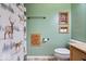Neutral bathroom featuring wood accents, single vanity, and animal print shower curtain at 10417 Mayapple Ct, Noblesville, IN 46060