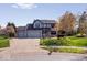 Inviting brick home with mature trees, well-maintained landscaping, and a spacious driveway at 10417 Mayapple Ct, Noblesville, IN 46060
