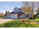 Charming two-story brick home with well-manicured lawn and mature landscaping at 10417 Mayapple Ct, Noblesville, IN 46060
