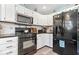 Kitchen featuring stainless steel appliances and white cabinetry at 10417 Mayapple Ct, Noblesville, IN 46060