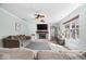 Comfortable living space with a brick fireplace, stylish furnishings, and ample natural light at 10417 Mayapple Ct, Noblesville, IN 46060