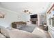 Inviting living area featuring a fireplace, comfortable sofas, and a cozy atmosphere at 10417 Mayapple Ct, Noblesville, IN 46060