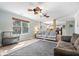 Bright living room with modern decor, large windows, and an open floor plan at 10417 Mayapple Ct, Noblesville, IN 46060