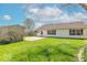 An expansive backyard featuring a storage shed, patio, lush lawn, and privacy fence at 105 Fountain Dr, Mooresville, IN 46158