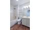 This bathroom showcases a tub, shower, storage shelves, and modern lighting for optimal relaxation at 105 Fountain Dr, Mooresville, IN 46158